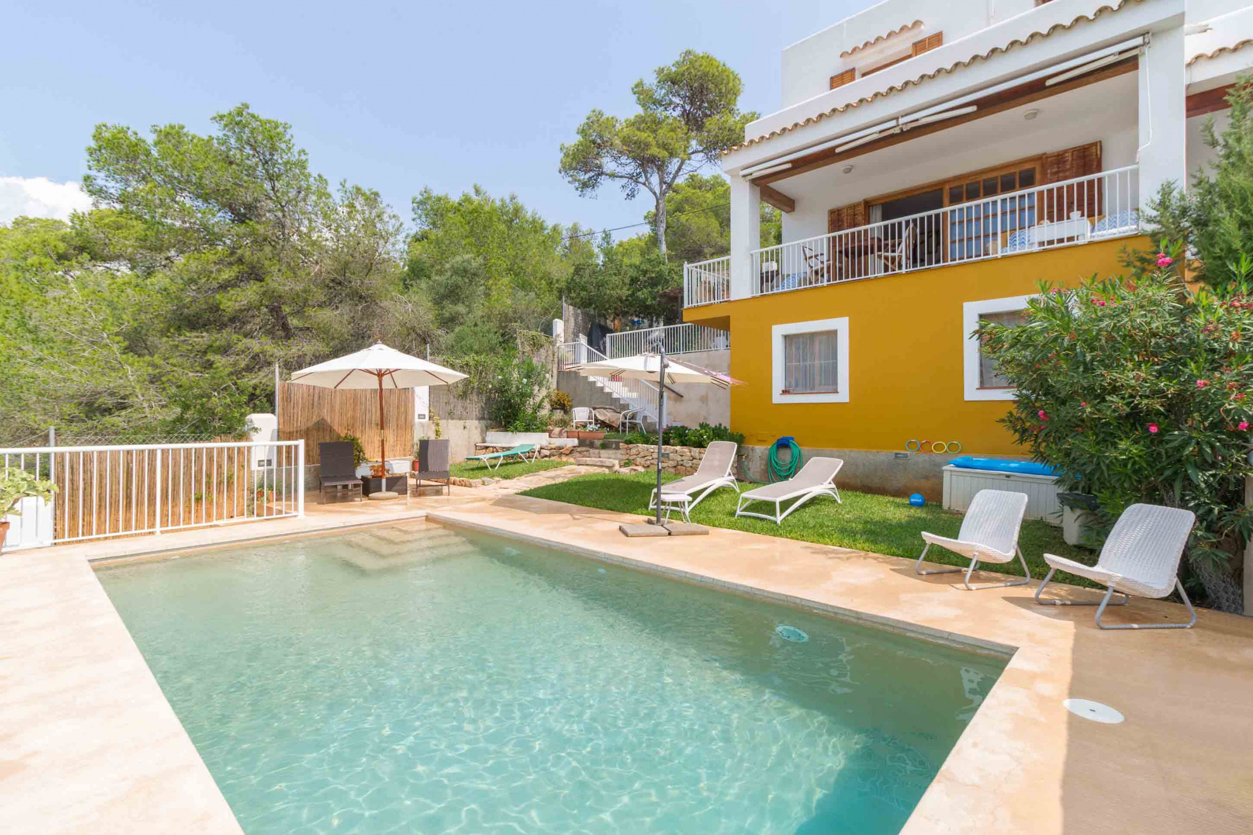 Private swimming pool and garden at Casa Mar in Ibiza