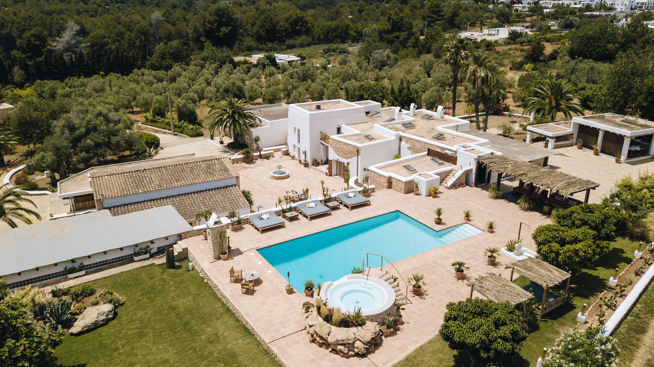 Aerial view of Villa Las Hadas in Ibiza with its pool, terrace, and jacuzzi