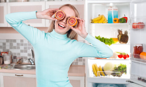 Girl filling fridge in Ibiza