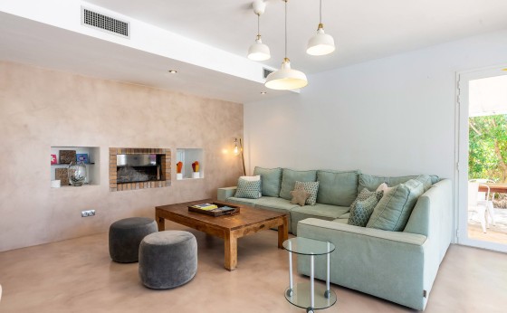 Elegant living-dining space with a fireplace