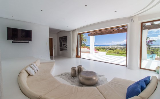 Stylish living room with large windows and sea view