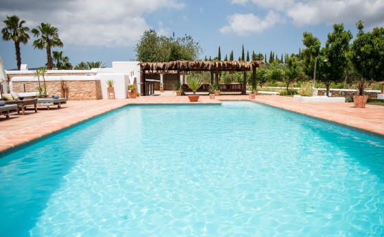 Beautiful pool with sun loungers and views of the house